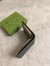 Gucci Bi-fold Wallet in Black Supreme Canvas with Green Interior